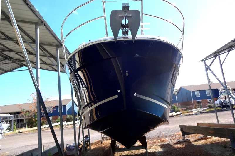 Slide: The Image of 2022 Jeanneau Merry Fisher 895 Offshore boat under shelter, front view. - 4