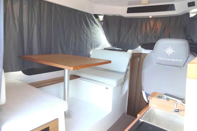 Slide: The Image of Interior of 2022 Jeanneau Merry Fisher 895 Offshore, featuring seating and dining area. - 47