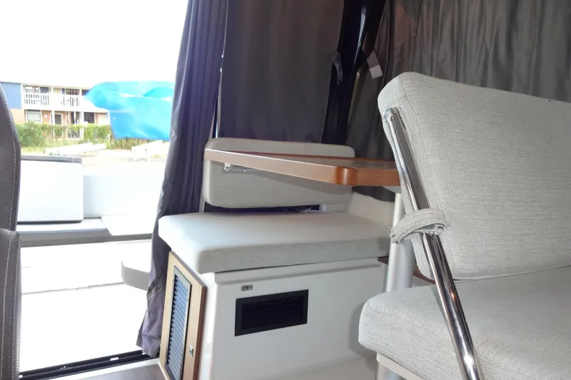 Slide: The Image of Interior of 2022 Jeanneau Merry Fisher 895 Offshore, featuring seating and table. - 49