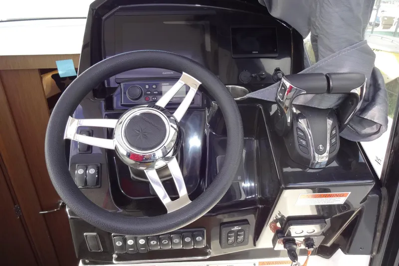 Slide: The Image of Steering console of 2022 Jeanneau Merry Fisher 895 Offshore boat with controls and display. - 64