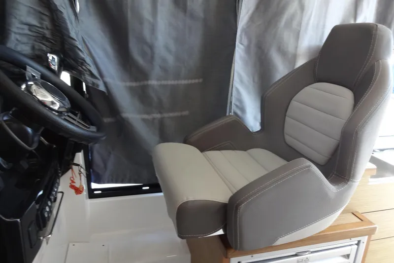 Slide: The Image of Captain's seat in 2022 Jeanneau Merry Fisher 895 Offshore boat cockpit. - 68