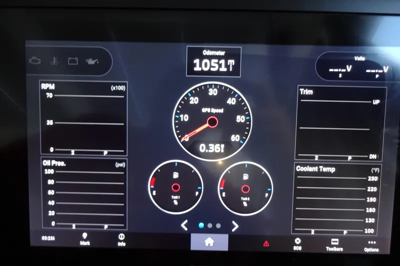 Slide: The Image of Dashboard of 2022 Jeanneau Merry Fisher 895 Offshore showing speed, RPM, and gauges. - 74