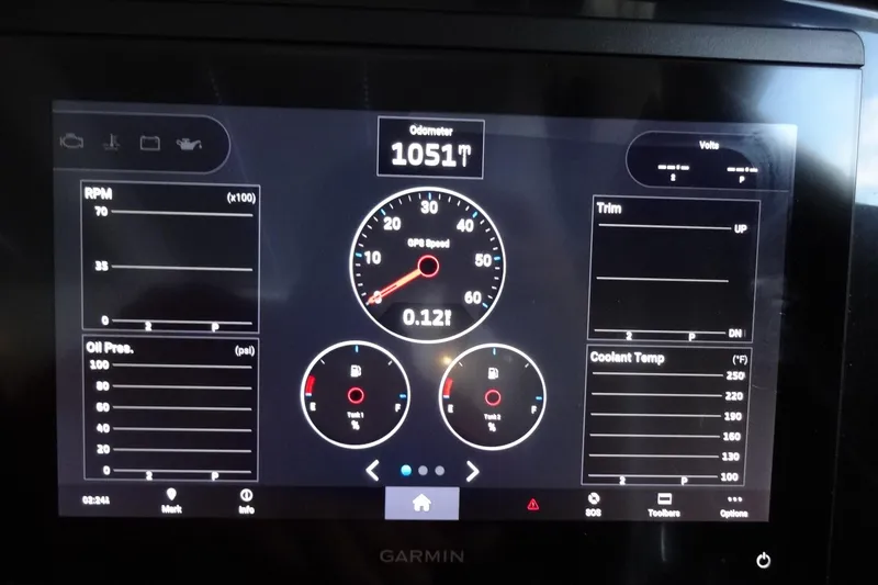 Slide: The Image of Dashboard of 2022 Jeanneau Merry Fisher 895 Offshore showing RPM, speed, and gauges. - 82