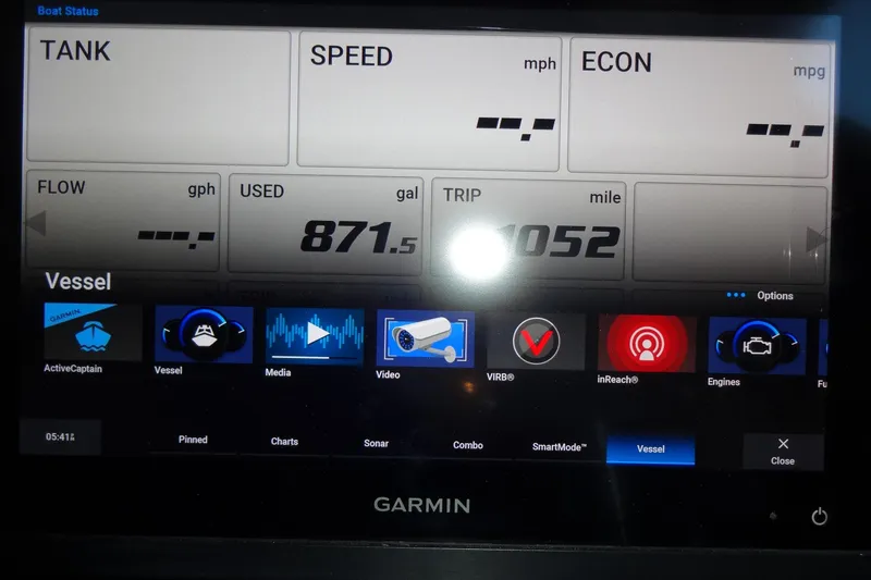 Slide: The Image of Garmin display on 2022 Jeanneau Merry Fisher 895 Offshore showing vessel status and navigation options. - 92