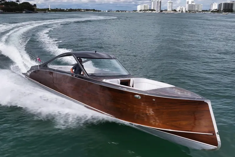 The Image of 2023 StanCraft 390 Hammerhead luxury boat cruising on open water. - 1