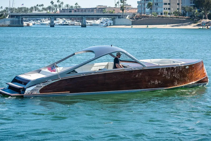 Slide: The Image of 2023 StanCraft 390 Hammerhead luxury boat cruising on a sunny day. - 5