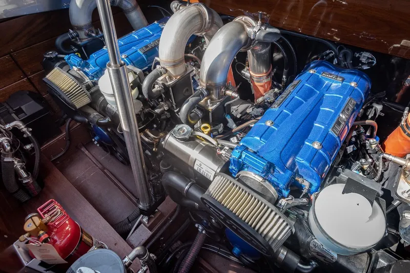 Slide: The Image of Engine compartment of 2023 StanCraft 390 Hammerhead with dual blue engines. - 8