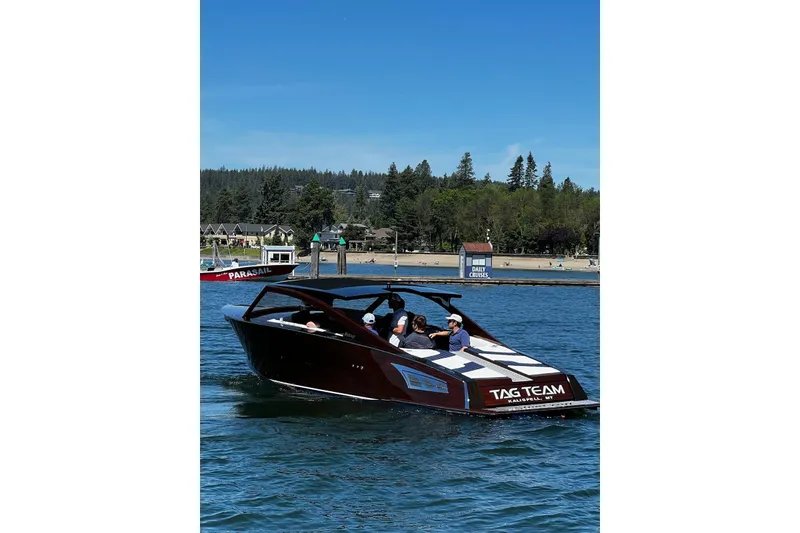 Slide: The Image of 2023 StanCraft 340 Darkside boat cruising on a lake with passengers onboard. - 3
