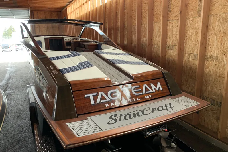 Slide: The Image of 2023 StanCraft 340 Darkside boat in a wooden garage, showcasing elegant design and craftsmanship. - 6