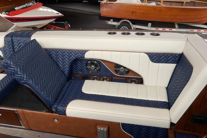 Slide: The Image of Luxurious interior seating of 2023 StanCraft 340 Darkside boat with blue and white upholstery. - 9