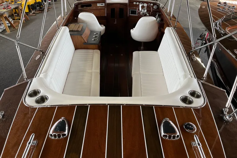 Slide: The Image of Luxurious 2013 StanCraft 34 Highboy Deluxe boat interior with white seating and wooden accents. - 11