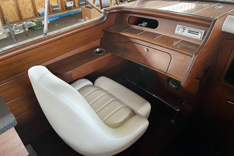 Slide: The Image of Luxurious interior of 2013 StanCraft 34 Highboy Deluxe with wood finish and white seating. - 14