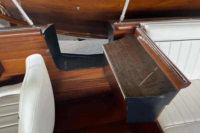 Slide: The Image of Interior of 2013 StanCraft 34 Highboy Deluxe with wood and white leather seating. - 20