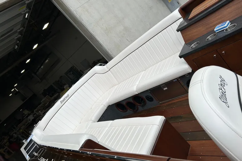 Slide: The Image of Luxurious interior of 2013 StanCraft 34 Highboy Deluxe boat with white seating. - 3