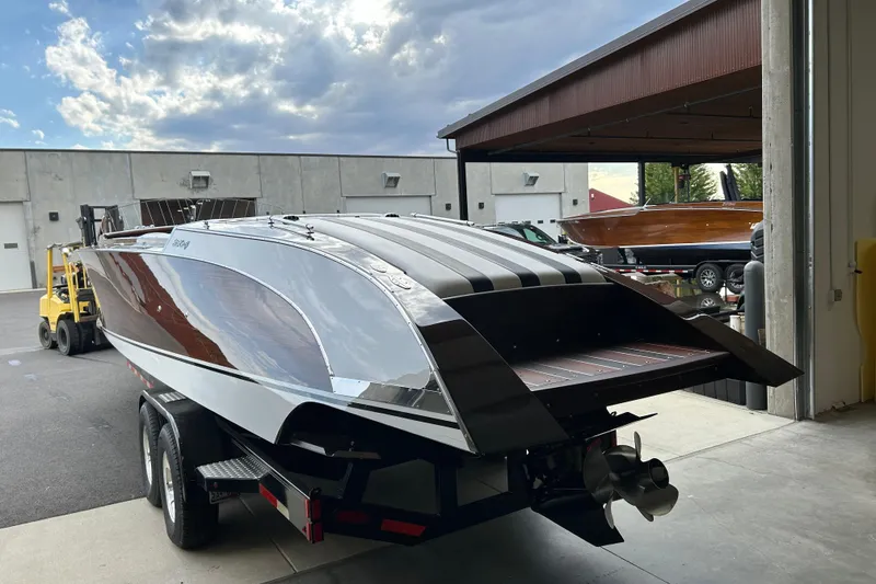 Slide: The Image of 2013 StanCraft 34 Highboy Deluxe boat on trailer in a garage setting. - 6