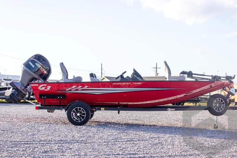 Slide: The Image of 2026 G3 Sportsman 1710 SE boat in vibrant red on a trailer. - 11