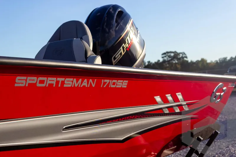 Slide: The Image of 2026 G3 Sportsman 1710 SE boat, red exterior, sleek design, close-up view. - 16