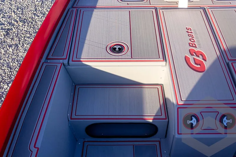 Slide: The Image of 2026 G3 Sportsman 1710 SE boat deck with red accents and storage compartments. - 22