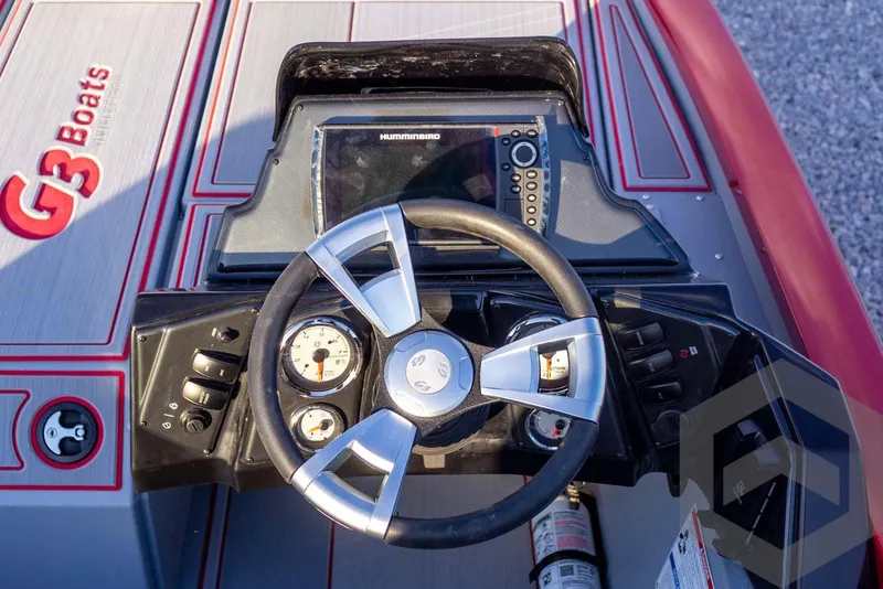 Slide: The Image of Dashboard of 2026 G3 Sportsman 1710 SE boat with steering wheel and controls. - 32