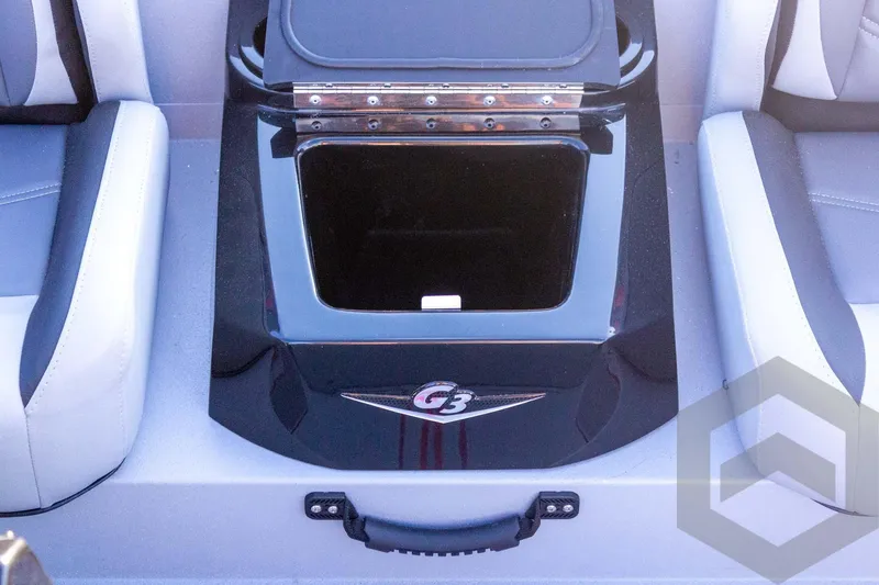 Slide: The Image of 2026 G3 Sportsman 1710 SE boat interior with storage compartment between seats. - 41