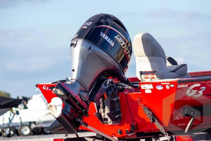 Slide: The Image of 2026 G3 Sportsman 1710 SE boat with Yamaha outboard motor, red exterior. - 5