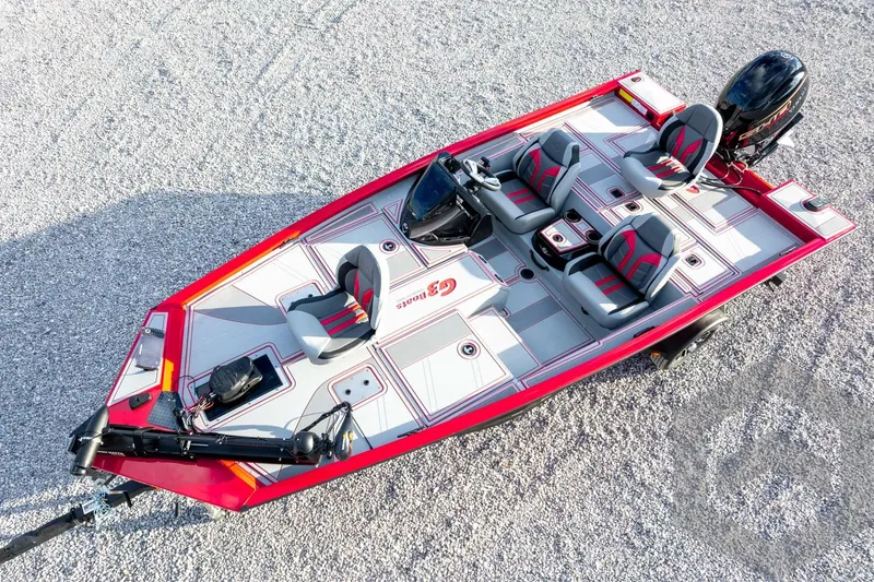 Slide: The Image of 2026 G3 Sportsman 1710 SE boat, red and gray design, aerial view on gravel. - 53