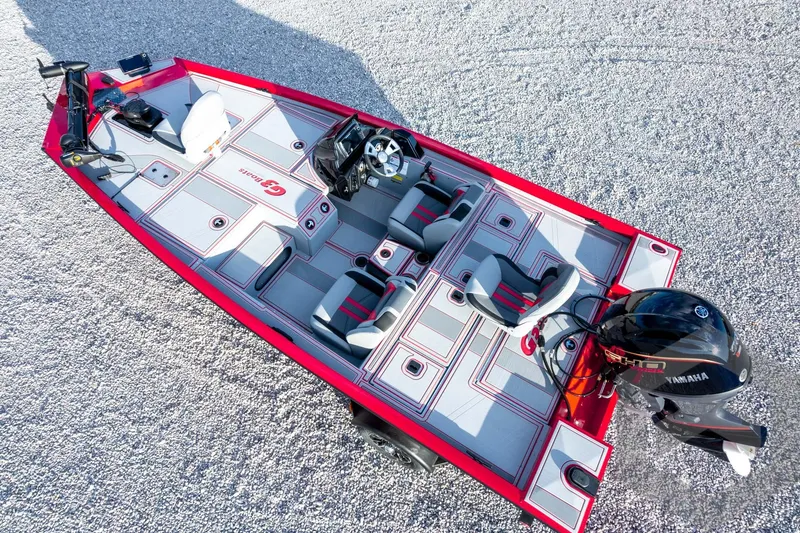 Slide: The Image of 2026 G3 Sportsman 1710 SE boat with Yamaha motor, red and gray interior, aerial view. - 55