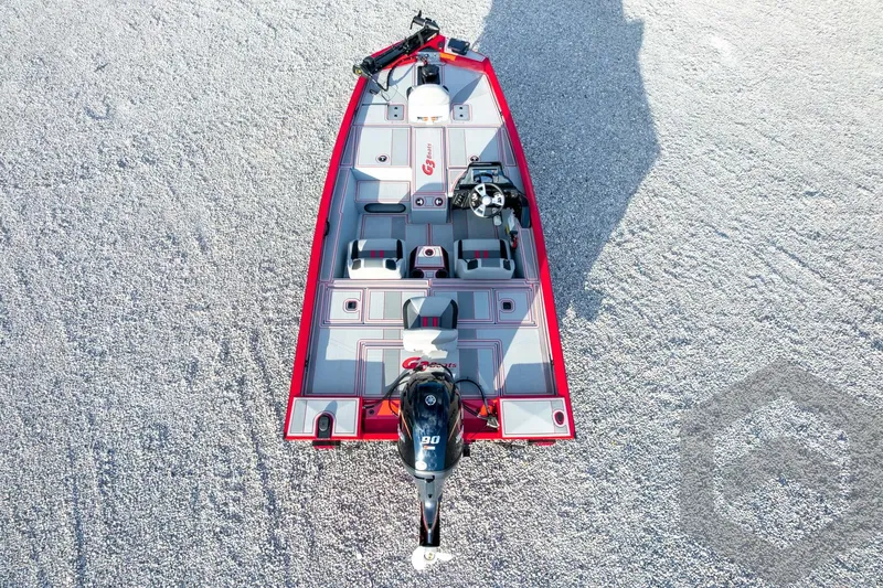 Slide: The Image of 2026 G3 Sportsman 1710 SE boat, aerial view, red and gray design on gravel surface. - 56