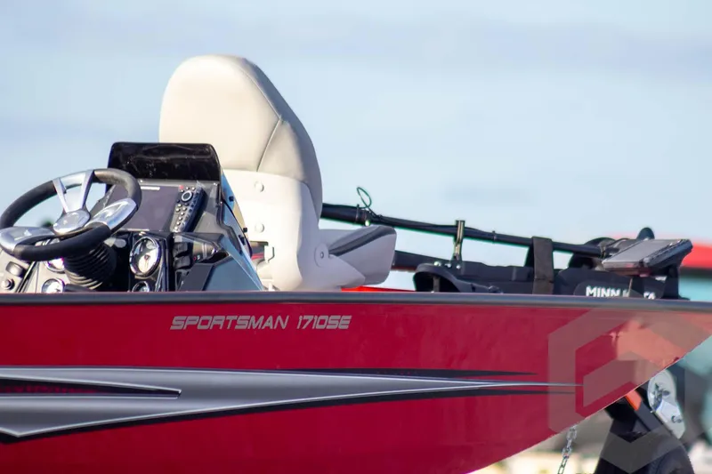 Slide: The Image of Red 2026 G3 Sportsman 1710 SE boat with steering wheel and control panel. - 6