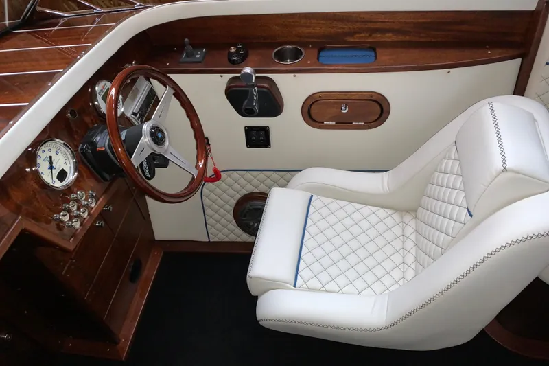 Slide: The Image of Luxurious interior of 2017 StanCraft 24 Highboy Surf boat with elegant wood and leather details. - 12