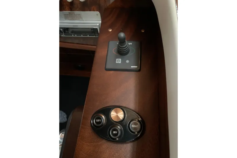 Slide: The Image of Control panel of 2017 StanCraft 24 Highboy Surf boat with joystick and buttons. - 16