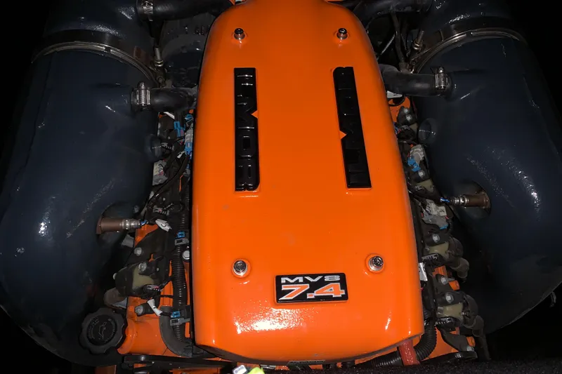Slide: The Image of Engine of 2017 StanCraft 24 Highboy Surf, featuring orange MV8 7.4 cover. - 19