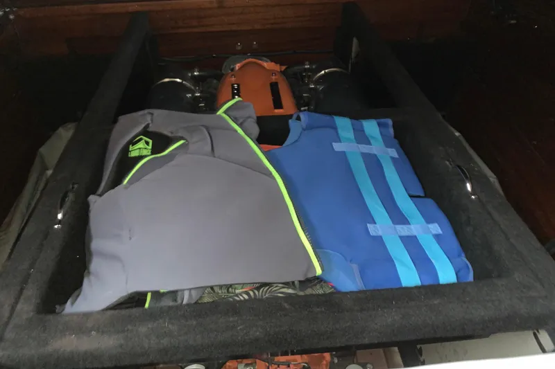 Slide: The Image of Life jackets on a 2017 StanCraft 24 Highboy Surf boat engine compartment. - 20