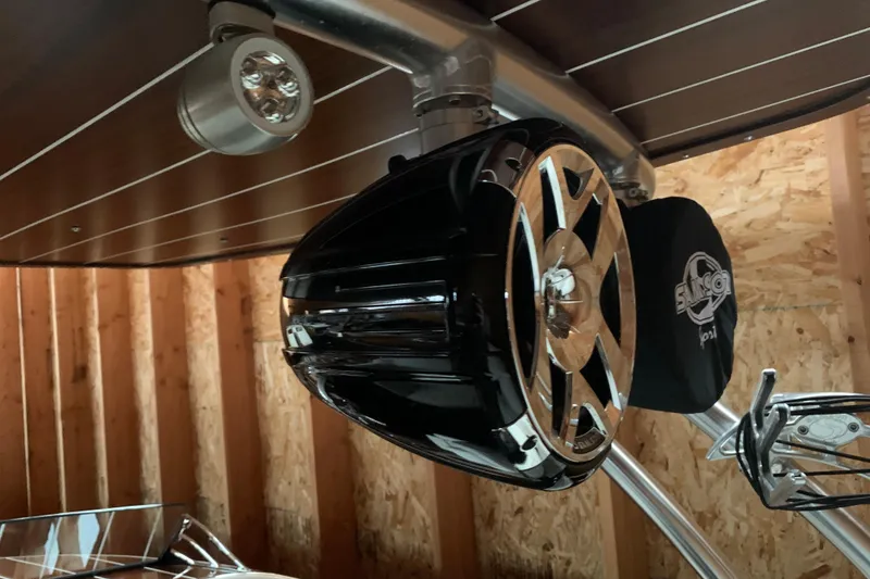 Slide: The Image of 2017 StanCraft 24 Highboy Surf boat speaker and light detail in wooden interior. - 21