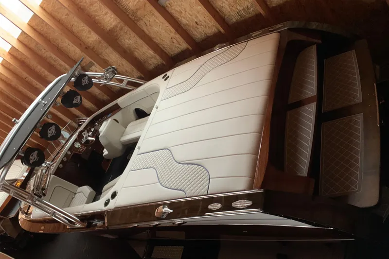 Slide: The Image of 2017 StanCraft 24 Highboy Surf boat with luxurious white interior and sleek design. - 5