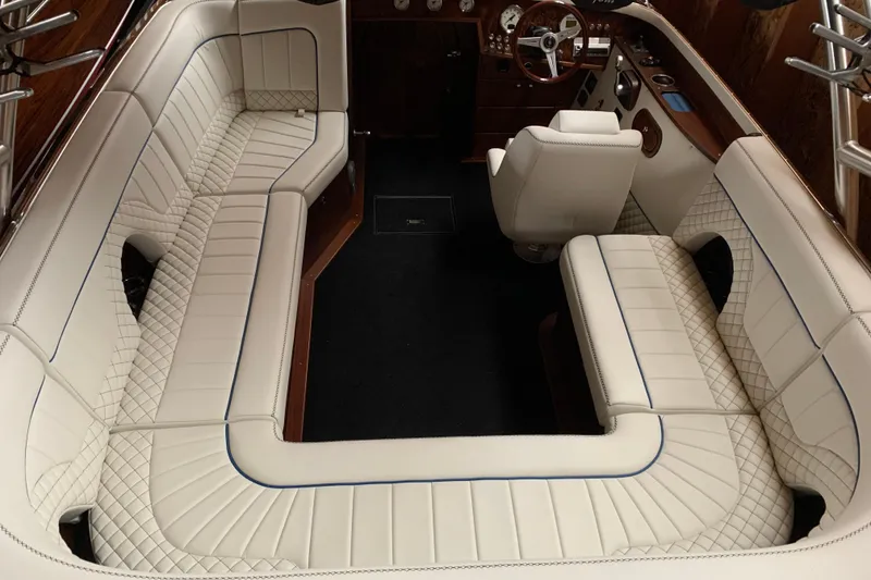 Slide: The Image of Luxurious interior of 2017 StanCraft 24 Highboy Surf boat with elegant white seating. - 7