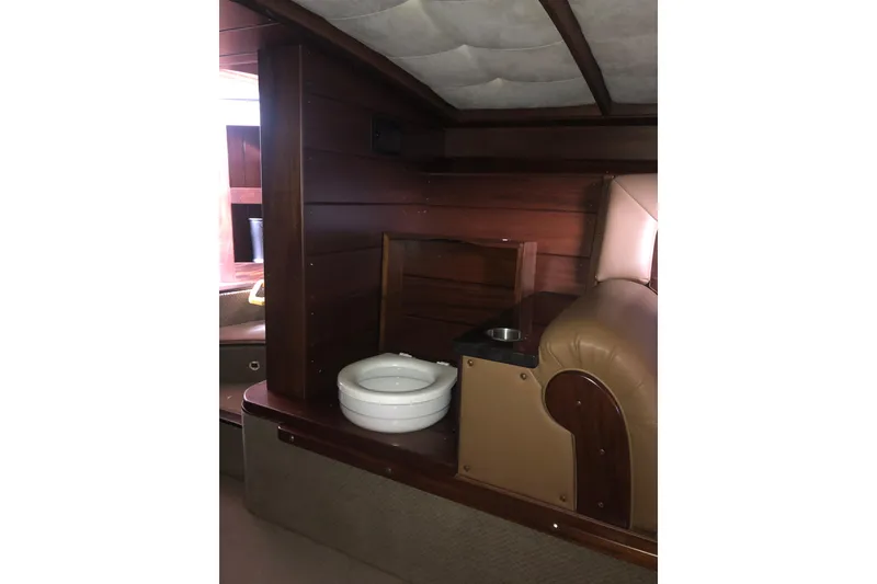 Slide: The Image of Interior of 2013 StanCraft 360 Rivelle boat with wooden paneling and seating. - 15