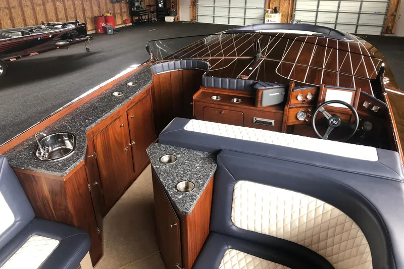 Slide: The Image of Luxurious 2013 StanCraft 360 Rivelle boat interior with wood finish and plush seating. - 20