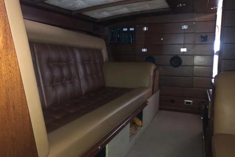 Slide: The Image of Interior of 2013 StanCraft 360 Rivelle with leather seating and wooden paneling. - 25