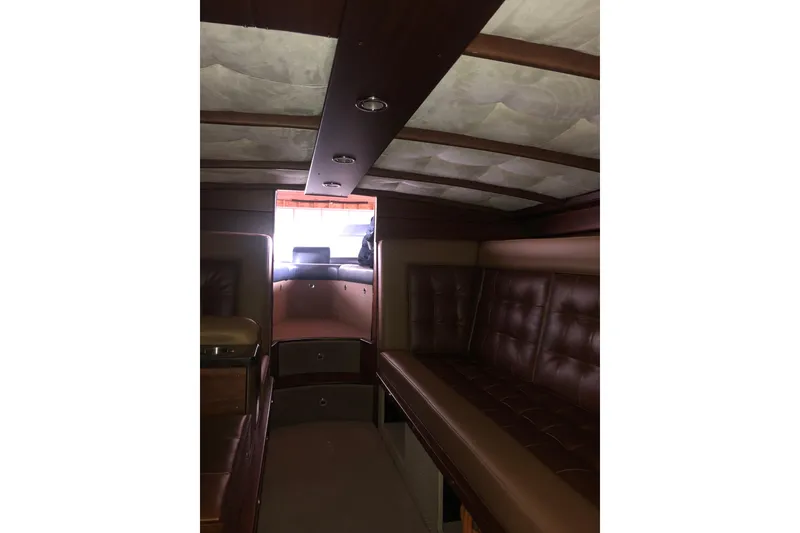 Slide: The Image of Interior of 2013 StanCraft 360 Rivelle boat with leather seating and wooden accents. - 26