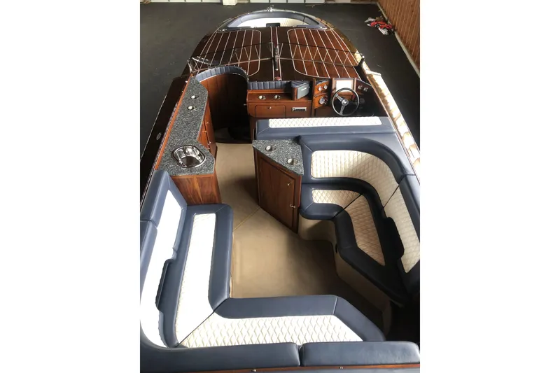 Slide: The Image of Luxurious interior of 2013 StanCraft 360 Rivelle boat with elegant seating and wood finish. - 28