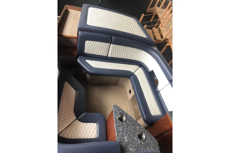 Slide: The Image of Luxurious interior of 2013 StanCraft 360 Rivelle boat with quilted seating and granite countertop. - 29