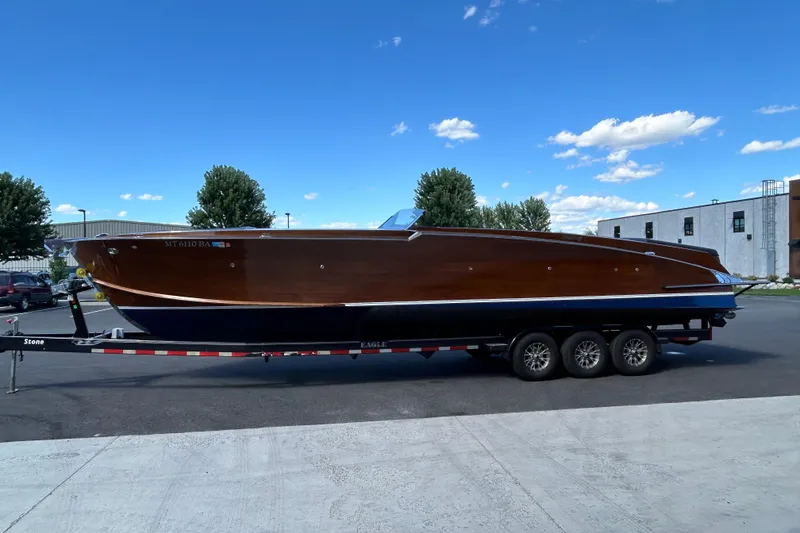 Slide: The Image of 2013 StanCraft 360 Rivelle boat on trailer under clear blue sky. - 7