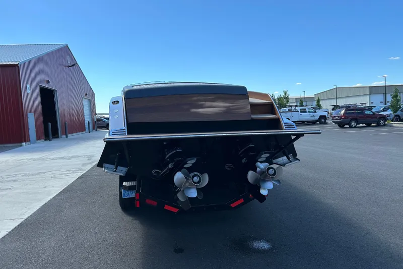 Slide: The Image of Rear view of 2013 StanCraft 360 Rivelle boat with dual propellers in a parking lot. - 9