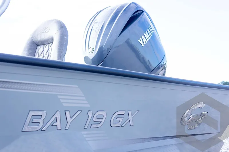 Slide: The Image of 2026 G3 Bay 19 GX boat with Yamaha engine, side view. - 13