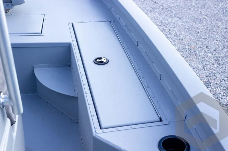 Slide: The Image of 2026 G3 Bay 19 GX boat interior with storage compartment and cup holder. - 22