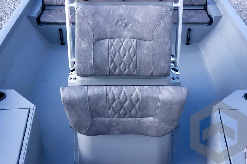 Slide: The Image of 2026 G3 Bay 19 GX boat interior with gray cushioned seats and storage compartments. - 29