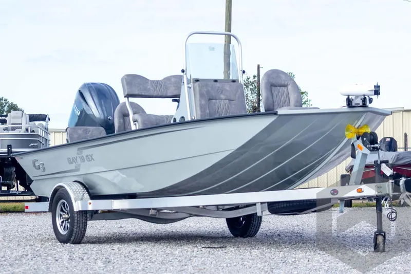 Slide: The Image of 2026 G3 Bay 19 GX boat on trailer, featuring sleek design and modern seating. - 3