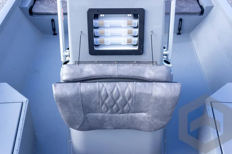 Slide: The Image of Interior of 2026 G3 Bay 19 GX boat with cushioned seating and storage compartments. - 31