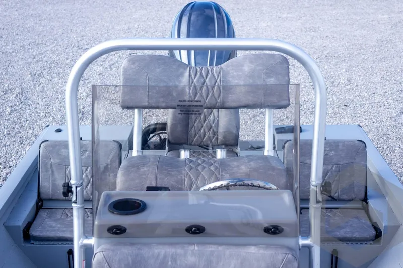 Slide: The Image of Interior view of 2026 G3 Bay 19 GX boat with cushioned seating and steering console. - 33